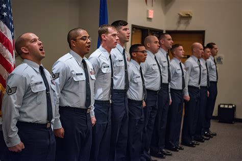 Air force recruiting - Maj. Gen. Konata Crumbly, Air National Guard advisor to the Air Force Recruiting Service commander, congratulates 5 members of the delayed enlistment program at the Ultimate Fighting Championship ...
